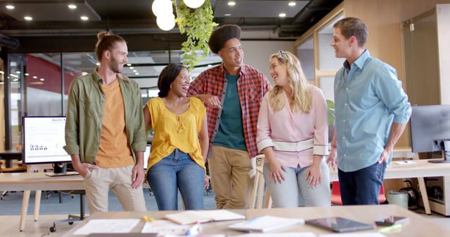 Motivated Team of Colleagues Smiling at Creative Office Workspace - Download Free Stock Images Pikwizard.com