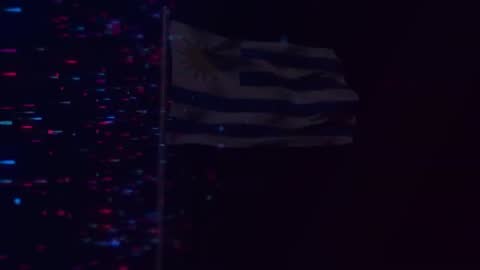 Uruguay Flag Flapping Gently Against Night Sky and Digital Streams