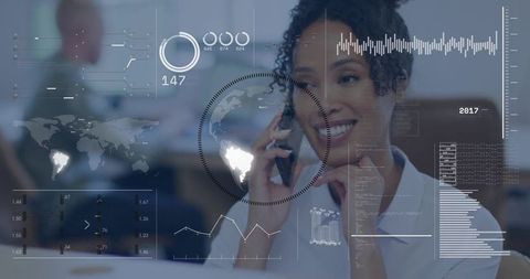 Smiling businesswoman using smartphone with holographic analytics dashboard overlay