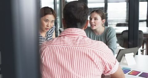 Business Meeting Discussion in Modern Office Setting