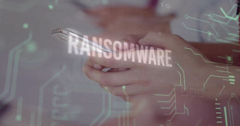 Hands holding smartphone displaying ransomware warning with circuit overlay and cyber threat