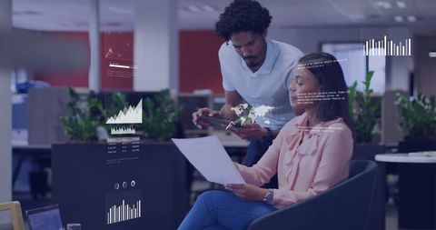 Team Analyzing Digital Data in Modern Office Environment