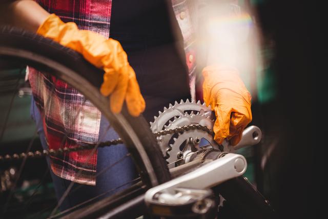 This image is ideal for use in articles or advertisements related to bicycle maintenance, repair services, or cycling gear. It can also be used in instructional materials or blogs about DIY bike repairs.