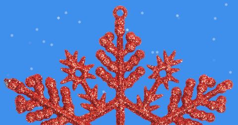 Red Glittery Christmas Star Against Blue with Snowflakes - Download Free Stock Images Pikwizard.com