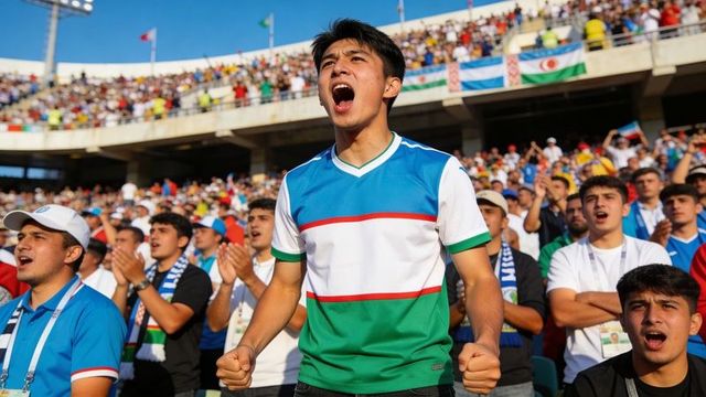 Passionate football fans cheering in blue-white-green jerseys at crowded stadium