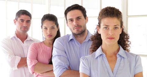 Diverse Creative Team Standing in Modern Office Environment