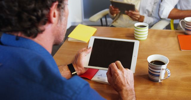 Business Team Collaborating over Digital Tablets in Office - Download Free Stock Images Pikwizard.com