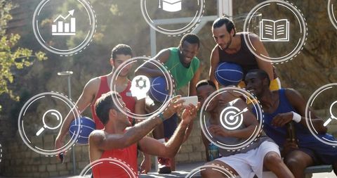 Sunlit urban basketball team selfie on bench holding balls and smartphone casual summer