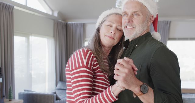 Happy Senior Couple Dancing and Celebrating Christmas at Home - Download Free Stock Images Pikwizard.com