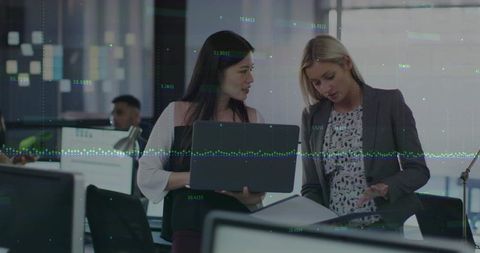 Women collaborating in modern office during business analysis