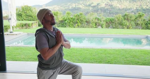 Man Practicing Yoga With Serene Mountain View Outdoors