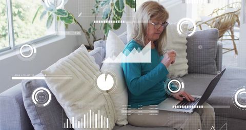 Senior Woman Analyzing Data with Digital Interface
