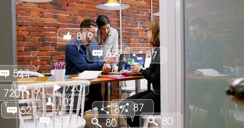 Startup team reviewing digital metrics and brainstorming social media strategy with metric overlays