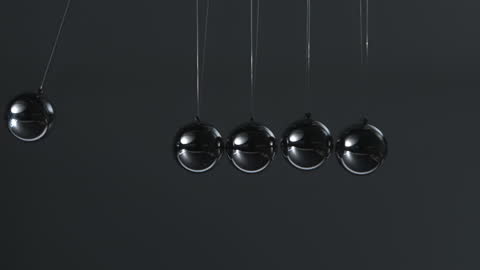Close-Up of Newton's Cradle in Slow Motion for Physics Concept