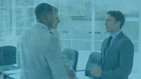 Diverse Businessmen Discussing Financial Data in Modern Office