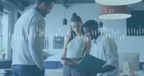 Diverse Team Analyzing Financial Data Visualizations in Modern Office