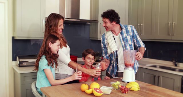 Happy Family Making Smoothies in Modern Kitchen - Download Free Stock Images Pikwizard.com