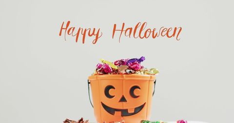 Happy Halloween Candy Bucket with Pumpkin Design - Download Free Stock Images Pikwizard.com