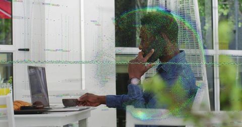 Man Enjoying Remote Work on Patio with Laptop and Smartphone