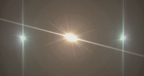 Abstract Light Flare and Rays on Dark Background