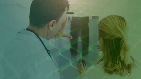 Caucasian Doctors Analyzing Digital X-Ray With Abstract Overlay