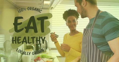 Diverse Couple Cooking Organic Meal Together in Modern Kitchen