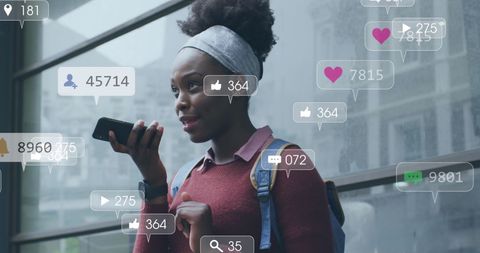 African American Woman Engaging with Social Media on Phone