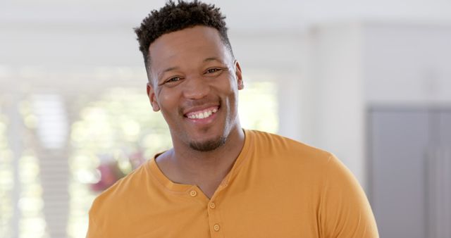 Portrait of happy african american man with short hair at home - Download Free Stock Photos Pikwizard.com