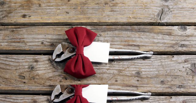 Red Bow Tie on Pliers on Wooden Surface - Download Free Stock Images Pikwizard.com