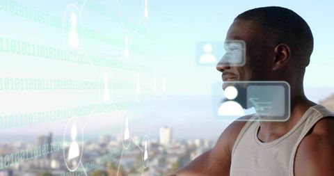 Man controlling holographic avatars with AR panels over urban rooftop skyline