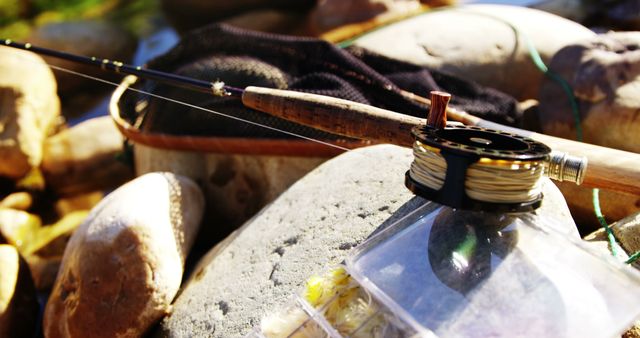 Fly Fishing Reel and Rod with Equipment on Rocks by River - Download Free Stock Images Pikwizard.com