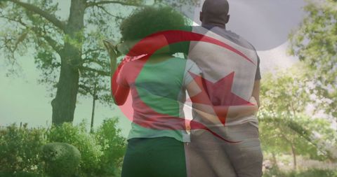 Couple with Algerian Flag Overlay Walking in Tranquil Garden