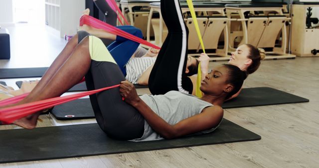 Multicultural Women Exercising with Resistance Bands in Fitness Class - Download Free Stock Images Pikwizard.com