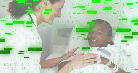 Smiling clinician comforting child patient at bedside with green digital binary overlay