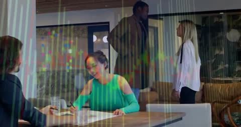 Dynamic Business Meeting with Graph Overlay Indicating Market Trends