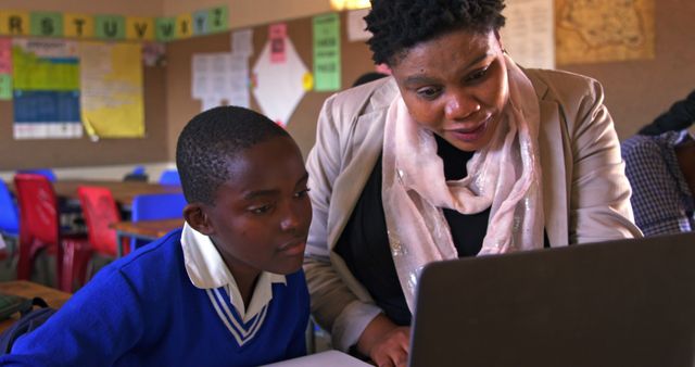 Teacher and Student Engaged in Interactive Lesson with Laptop - Download Free Stock Images Pikwizard.com