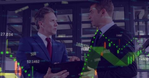 Businessmen Analyzing Financial Data on Tablet with Digital Charts