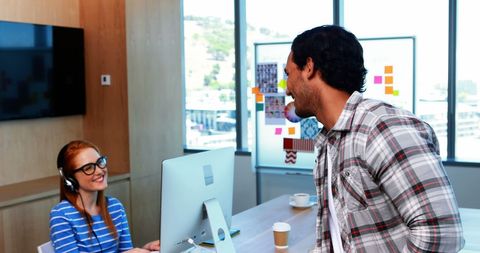 Friendly Workplace Interaction Between Colleagues in Modern Office - Download Free Stock Images Pikwizard.com