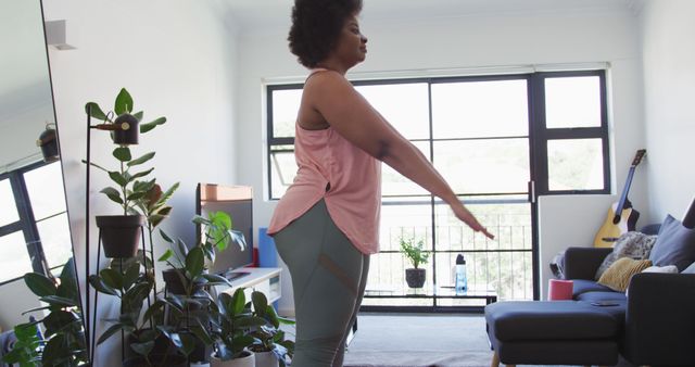 Woman Doing Yoga at Home in Living Room with Plants and Guitar - Download Free Stock Images Pikwizard.com