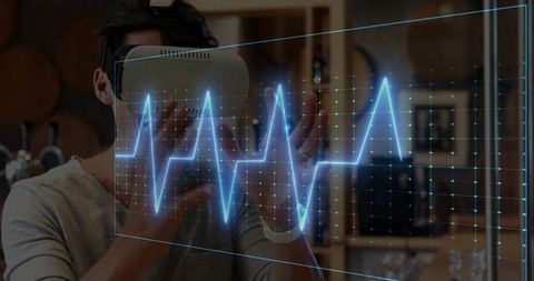 Man in VR Headset in Modern Living Room Engaging with Virtual Heart Monitor