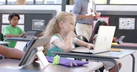 Engaged Girl Participating in Classroom with Laptop - Download Free Stock Images Pikwizard.com