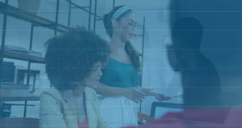 Diverse Team Collaborating in Modern Office with Financial Graphs Overlay