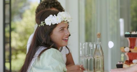 Joyful Woman with Flower Crown at Celebration Brunch