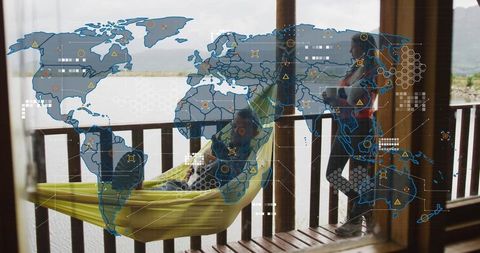 Couple relaxing on lakeside porch with hammock and holographic world map overlay