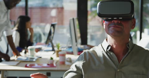 Man Engaged in Virtual Reality Technology in Modern Office
