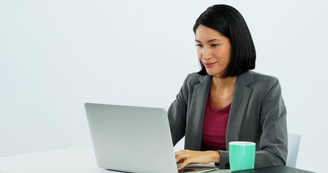 Focused Professional Woman Working on Laptop at Desk - Download Free Stock Images Pikwizard.com