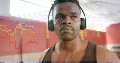 African american athlete wearing headphones tracking workout data hud in gym