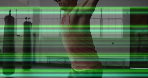 Man stretching in modern gym with neon motion effects