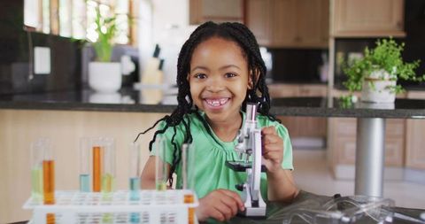Curious African American Girl Exploring Science at Home