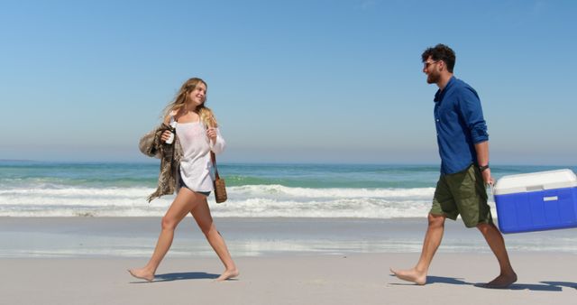 Couple Enjoying Beach Day by Ocean Waves - Download Free Stock Images Pikwizard.com